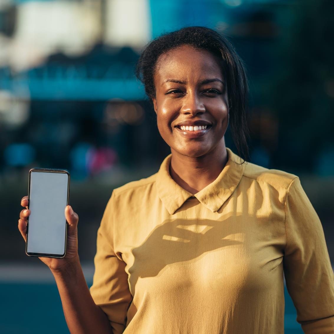 A marketer presenting a mobile experience on a smartphone